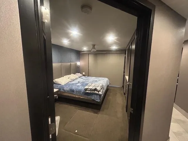 Slide: The Image of Bedroom interior of 2020 Adonia houseboat with modern lighting and cozy bedding. - 8