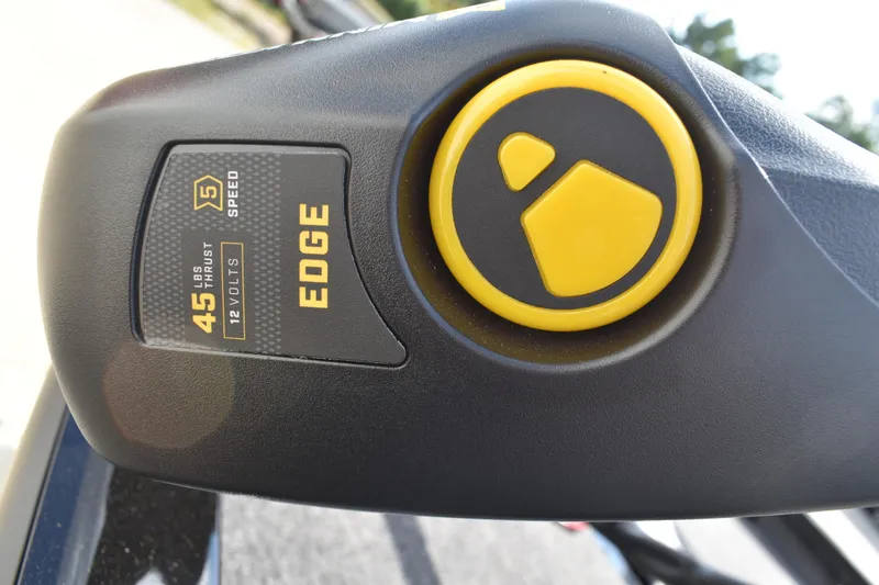 Slide: The Image of 2025 Lowe Stinger 175C boat interior with gray carpet and storage compartment. - 13