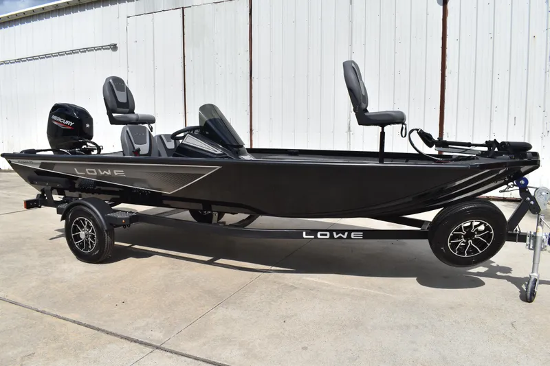 Slide: The Image of Trailer hitch and winch of 2025 Lowe Stinger 175C boat on concrete surface. - 2