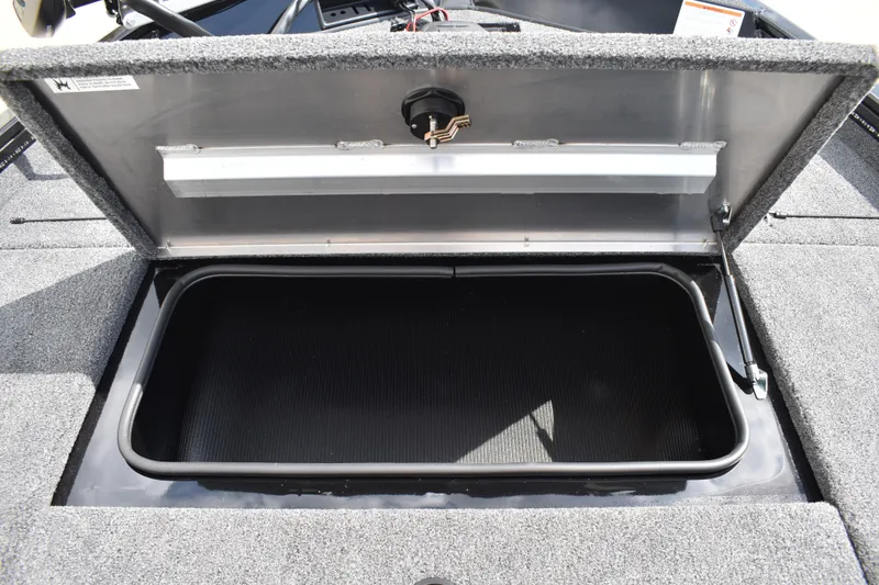 Slide: The Image of Open storage compartment in 2025 Lowe Stinger 175C boat, showcasing interior space. - 20