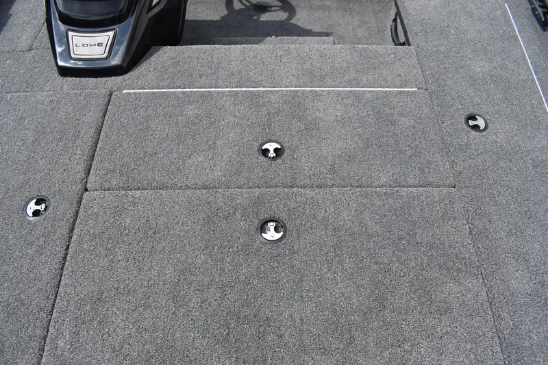 Slide: The Image of 2025 Lowe Stinger 175C boat storage compartment with open lid, showcasing interior space. - 21