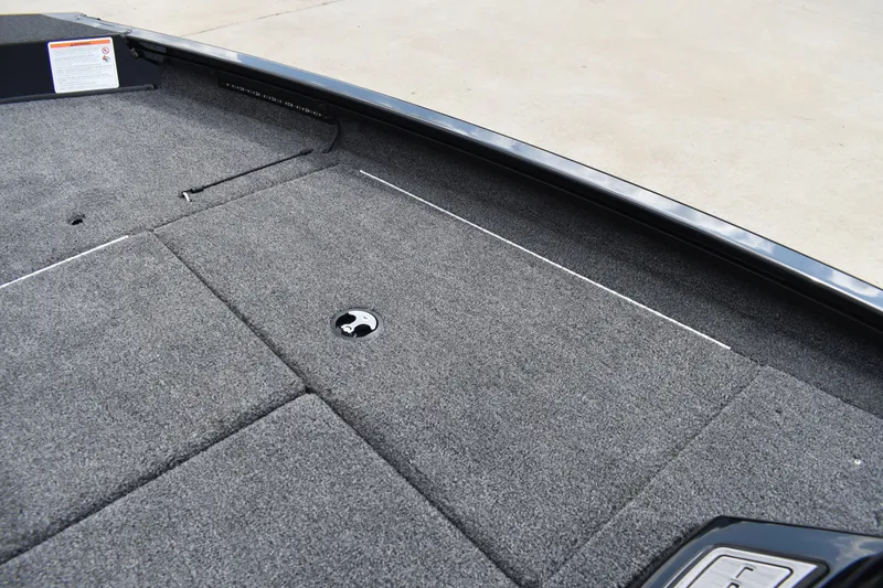 Slide: The Image of Open storage compartment in 2025 Lowe Stinger 175C boat, showcasing spacious interior. - 23