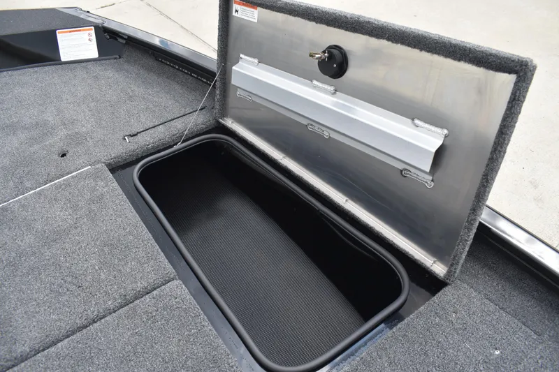 Slide: The Image of Carpeted deck of 2025 Lowe Stinger 175C boat with storage compartments. - 24