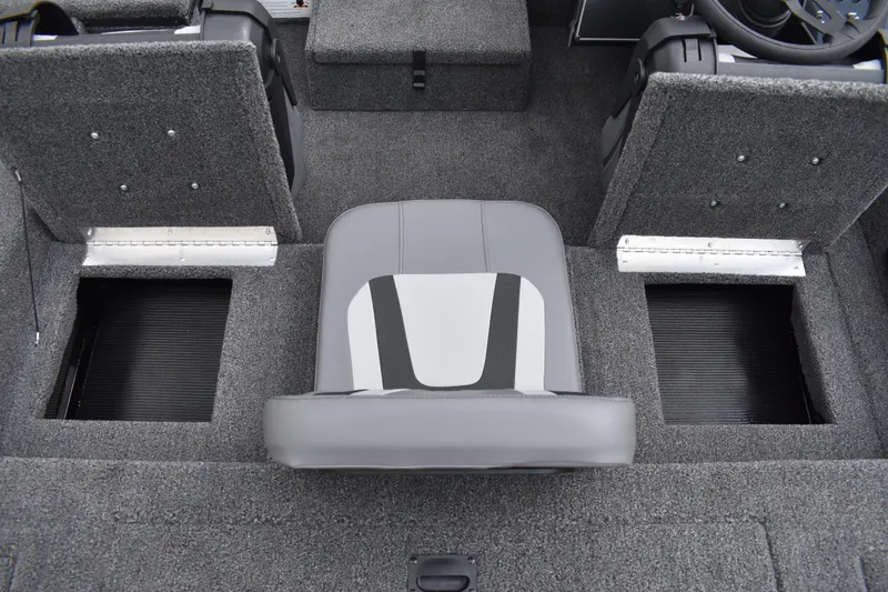 Slide: The Image of 2025 Lowe Stinger 175C boat storage compartment with open lid and secure lock. - 29