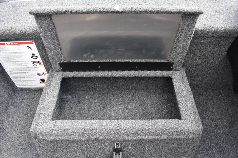 Slide: The Image of 2025 Lowe Stinger 175C boat dashboard with steering wheel and instrument panel. - 33