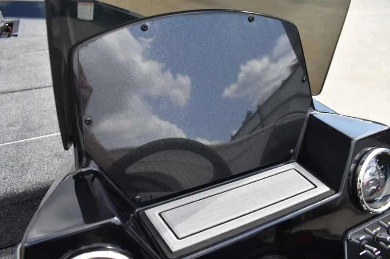 Slide: The Image of Steering wheel of 2025 Lowe Stinger 175C boat, featuring modern dashboard controls. - 36