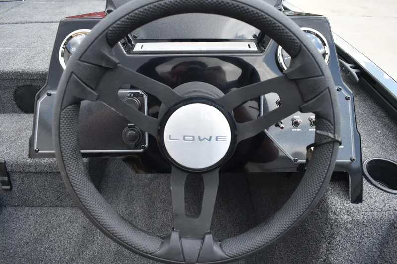 Slide: The Image of Close-up of 2025 Lowe Stinger 175C boat's steering mechanism and controls. - 37