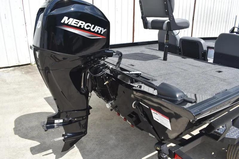 Slide: The Image of 2025 Lowe Stinger 175C trailer wheel with diamond plate step and black fender. - 4