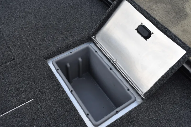 Slide: The Image of 2025 Lowe Stinger 175C boat deck with motor, featuring spacious carpeted surface. - 44