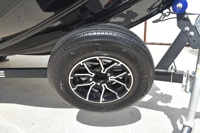 Slide: The Image of Open storage compartment on 2025 Lowe Stinger 175C boat deck. - 45