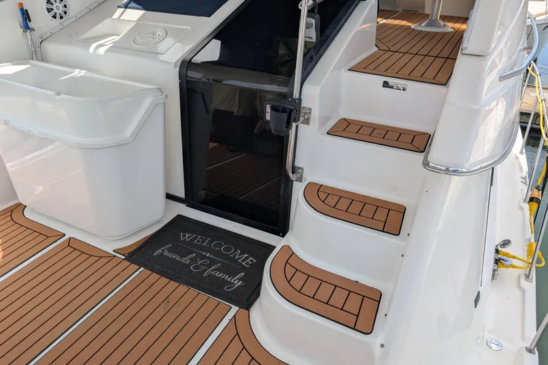Slide: The Image of Bayliner 4088 yacht interior with wooden steps and welcome mat, 2000 model. - 10