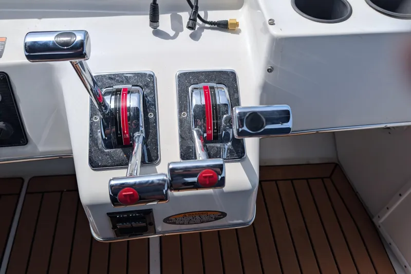 Slide: The Image of Dual throttle controls on a 2000 Bayliner 4088 boat dashboard. - 15