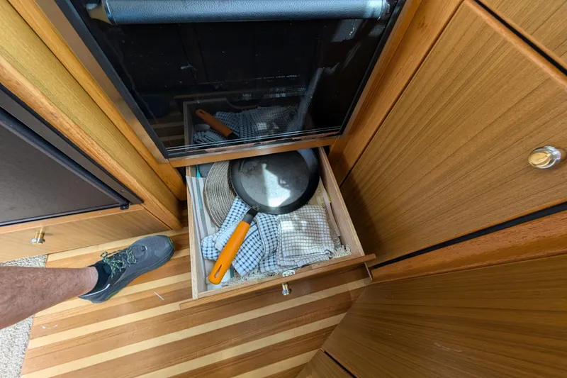 Slide: The Image of Open drawer with kitchen utensils in a 2000 Bayliner 4088 boat interior. - 26