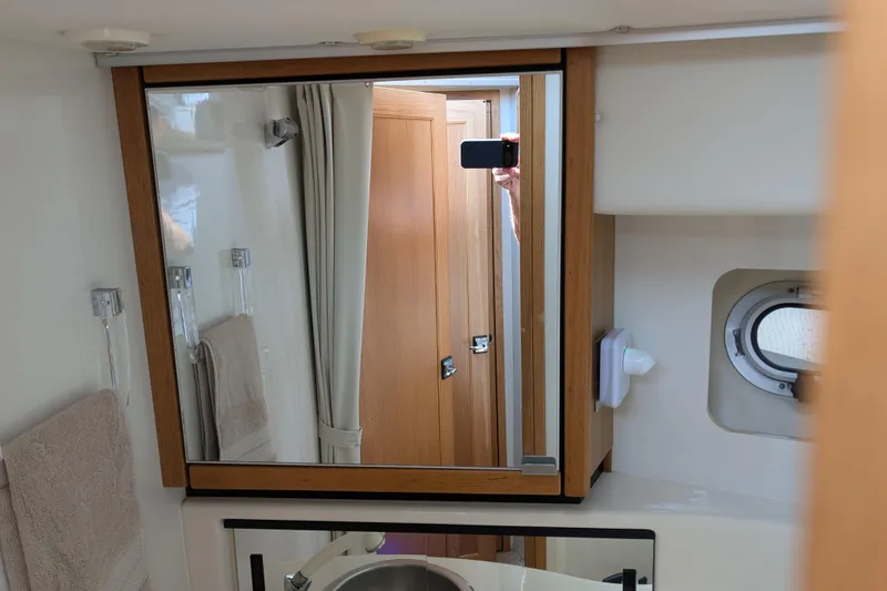 Slide: The Image of Bathroom interior of 2000 Bayliner 4088 yacht with mirror and porthole. - 36