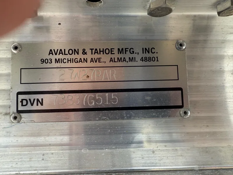 Slide: The Image of Metal plate displaying Avalon & Tahoe MFG details and DVN number for 2015 Avalon Paradise Funship. - 15