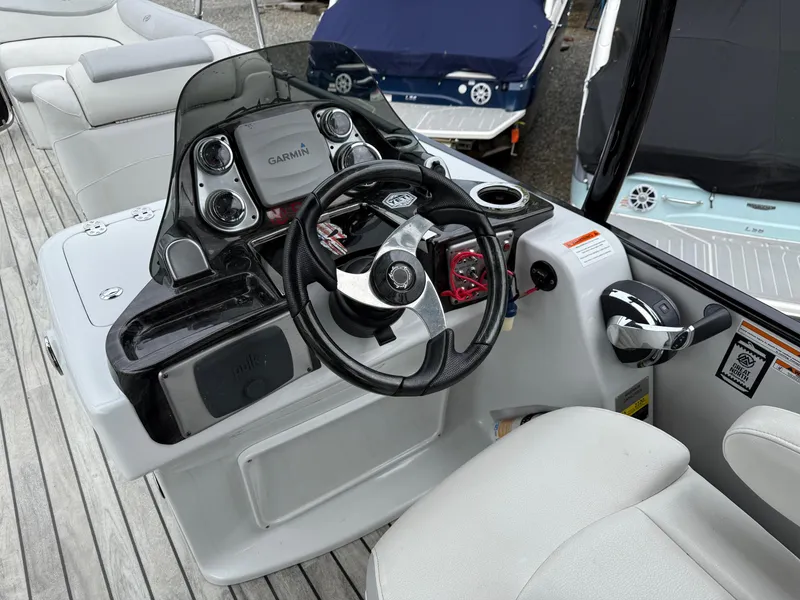 Slide: The Image of Steering console of a 2015 Avalon Paradise Funship 27' boat with modern controls. - 6