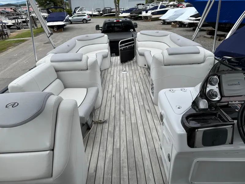 Slide: The Image of 2015 Avalon Paradise Funship 27' pontoon boat with spacious seating and modern dashboard. - 8