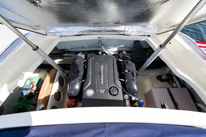Slide: The Image of Engine compartment of 2022 Chris-Craft Launch 27 boat, showcasing powerful engine and components. - 10