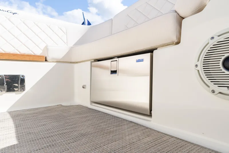 Slide: The Image of 2022 Chris-Craft Launch 27 interior with cushioned seating and built-in storage. - 5