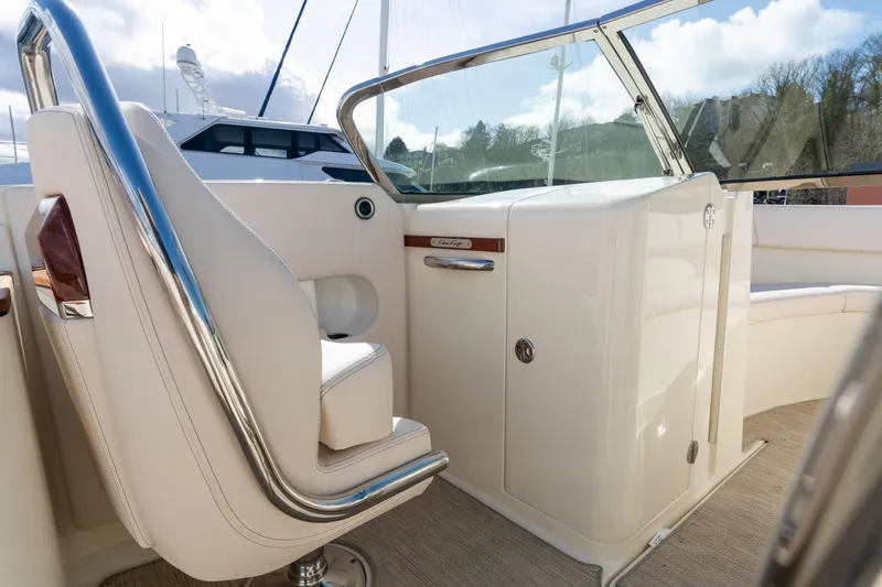 Slide: The Image of 2022 Chris-Craft Launch 27 boat interior with white seating and sleek design. - 8