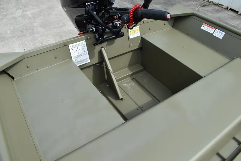 Slide: The Image of 2024 Lowe L1440M Jon boat interior with motor and seating. - 7