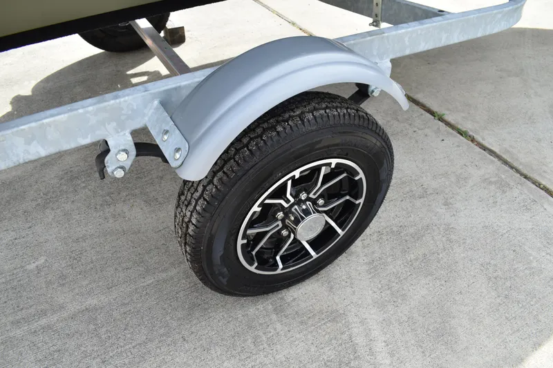 Slide: The Image of 2024 Lowe L1440M Jon boat trailer wheel on concrete surface. - 8