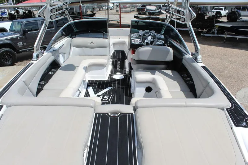 Slide: The Image of 2008 MasterCraft X45 boat interior with spacious seating and sleek dashboard design. - 11