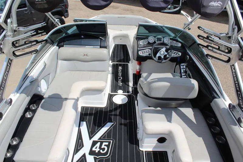 Slide: The Image of 2008 MasterCraft X45 boat interior with sleek seating and modern dashboard design. - 16