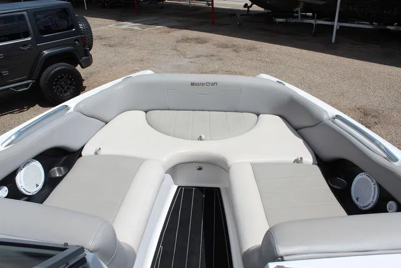 Slide: The Image of 2008 MasterCraft X45 boat interior with gray seating and speakers. - 19