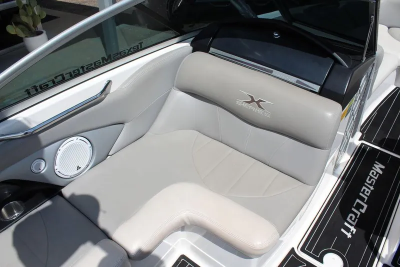 Slide: The Image of 2008 MasterCraft X45 boat interior with gray seating and speaker detail. - 20