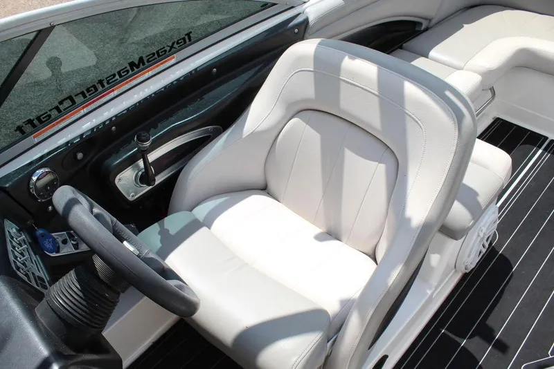 Slide: The Image of 2008 MasterCraft X45 boat interior with white leather seats and sleek dashboard design. - 24
