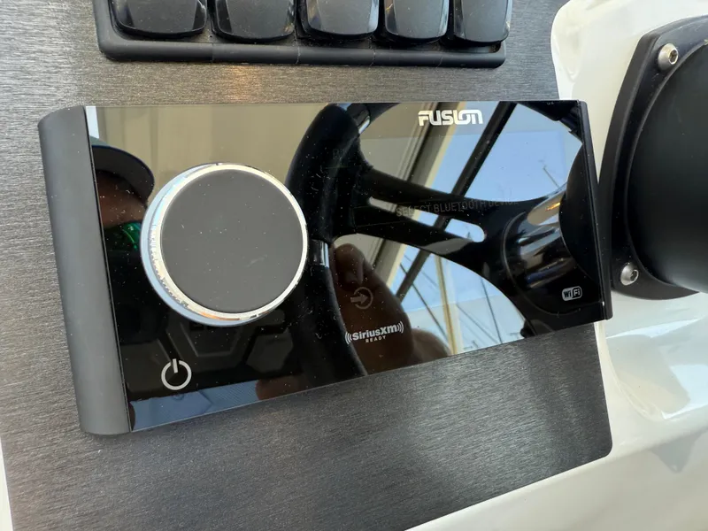 Slide: The Image of Fusion audio system on 2021 Beneteau Antares 8 boat dashboard. - 10