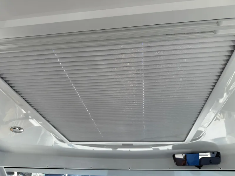 Slide: The Image of Interior view of 2021 Beneteau Antares 8 boat's ceiling with closed blinds. - 15