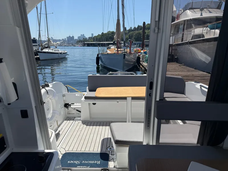 Slide: The Image of Interior view of 2021 Beneteau Antares 8 boat docked at marina. - 25