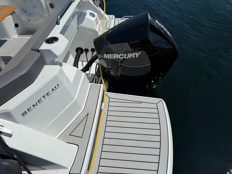Slide: The Image of Beneteau Antares 8 boat with Mercury outboard engine, 2021 model, docked on water. - 29