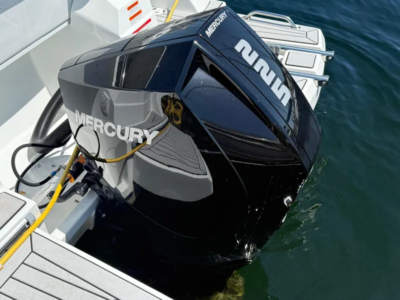Slide: The Image of Mercury outboard engine on a 2021 Beneteau Antares 8 boat, docked in water. - 30