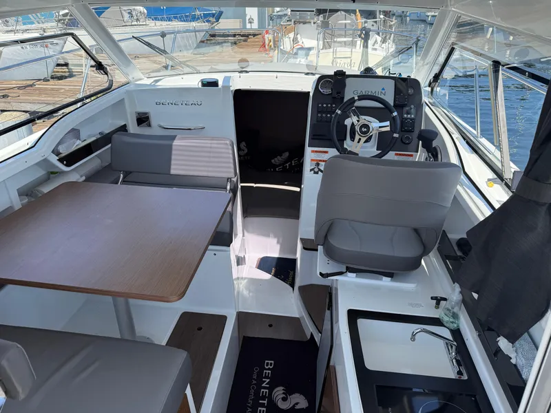 Slide: The Image of Interior of 2021 Beneteau Antares 8 boat with helm, seating, and table. - 4