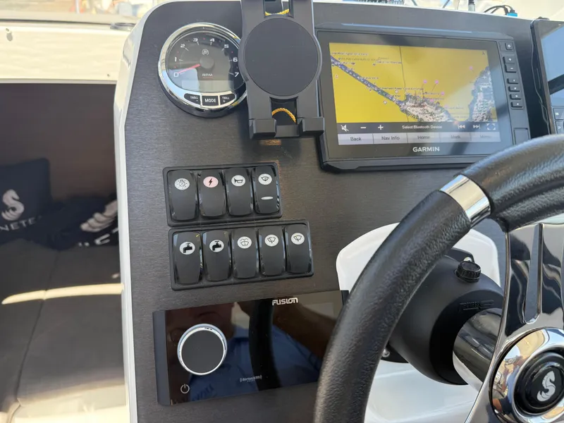 Slide: The Image of Dashboard of 2021 Beneteau Antares 8 with Garmin navigation system and controls. - 8