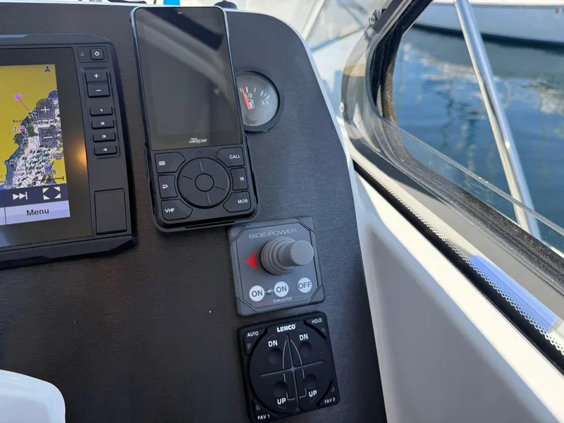 Slide: The Image of Control panel of 2021 Beneteau Antares 8 with navigation and communication devices. - 9