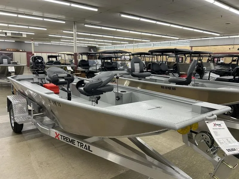 Slide: The Image of 2025 Xtreme River Skiff 1542SS boat displayed in showroom on Xtreme Trail trailer. - 4
