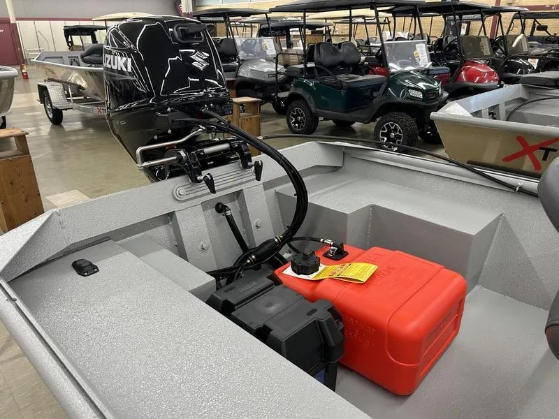 Slide: The Image of 2025 Xtreme River Skiff 1542SS with Suzuki outboard motor in showroom. - 6