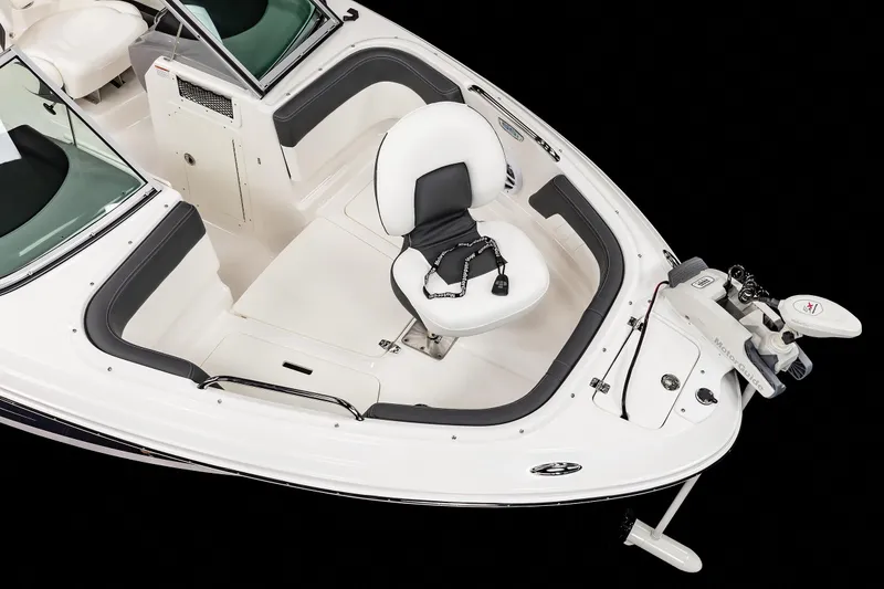 Slide: The Image of 2025 Chaparral OB Ski & Fish boat, white interior, fishing seat, and trolling motor. - 13