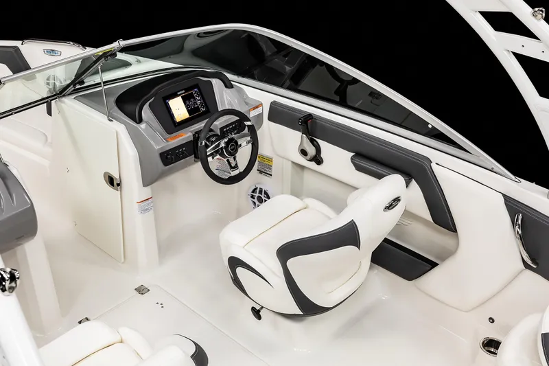 Slide: The Image of 2025 Chaparral OB Ski & Fish boat interior with modern dashboard and seating. - 16
