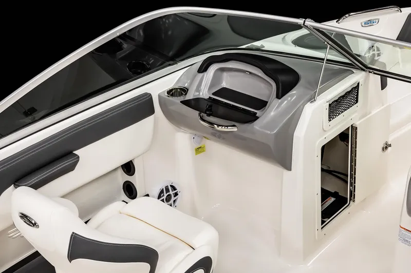 Slide: The Image of 2025 Chaparral OB Ski & Fish boat interior with seating and storage compartments. - 21