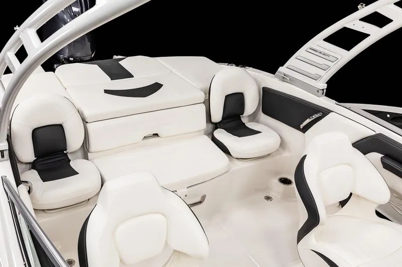 Slide: The Image of 2025 Chaparral OB Ski & Fish boat interior with white and black seating. - 23