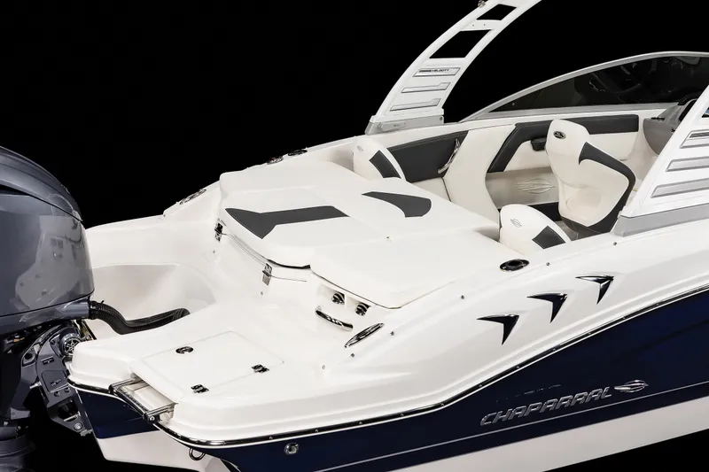 Slide: The Image of 2025 Chaparral OB Ski & Fish boat, sleek design, white and blue, modern seating, outboard motor. - 26