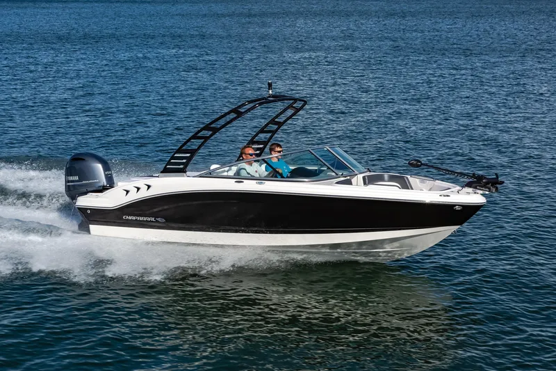 Slide: The Image of 2025 Chaparral OB Ski & Fish boat cruising on open water. - 6