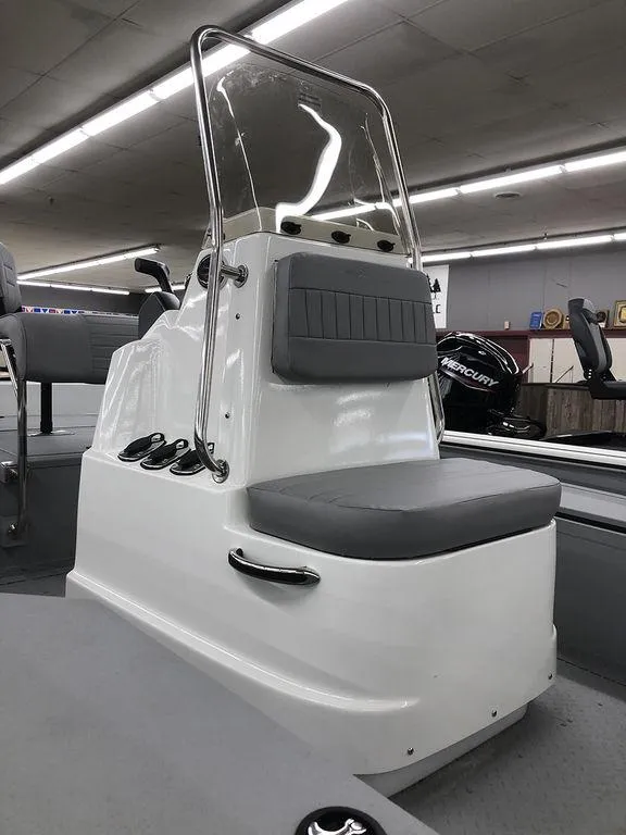 Slide: The Image of 2023 SeaArk BXT220 Bay Tunnel boat interior with console and seating. - 6