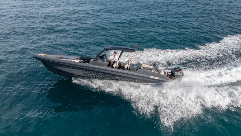 Slide: The Image of 2025 Skipper-BSK 38 boat cruising on open water, showcasing sleek design and powerful performance. - 32