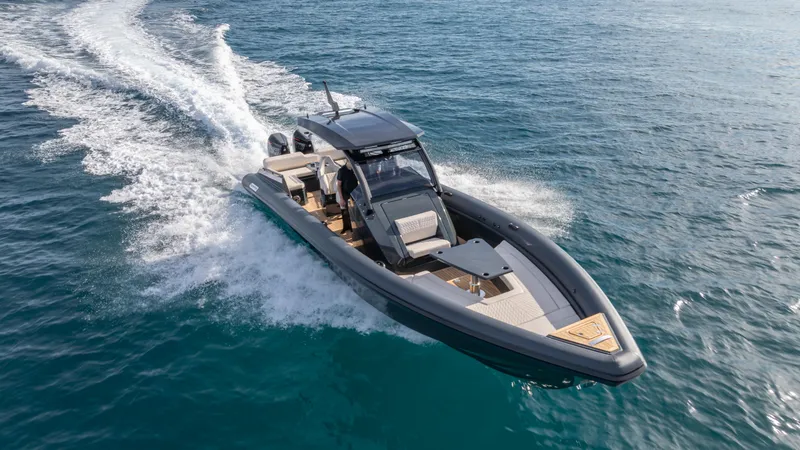 Slide: The Image of Skipper-BSK 38 boat cruising on open water, 2025 model. - 2